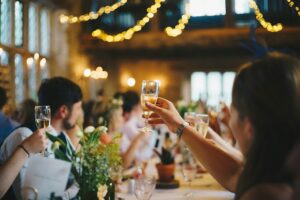 People cheersing at a wedding venue