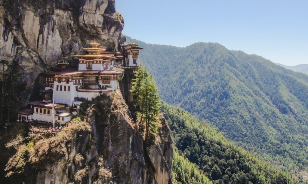 Monastery nestled into a cliff face in Bhutan