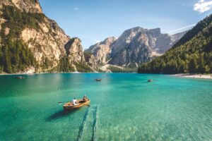 Wooden boats on a blue lake in Pragser Wildsee, Italy