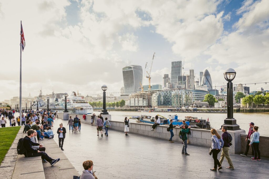 People walking along the River Thames in London